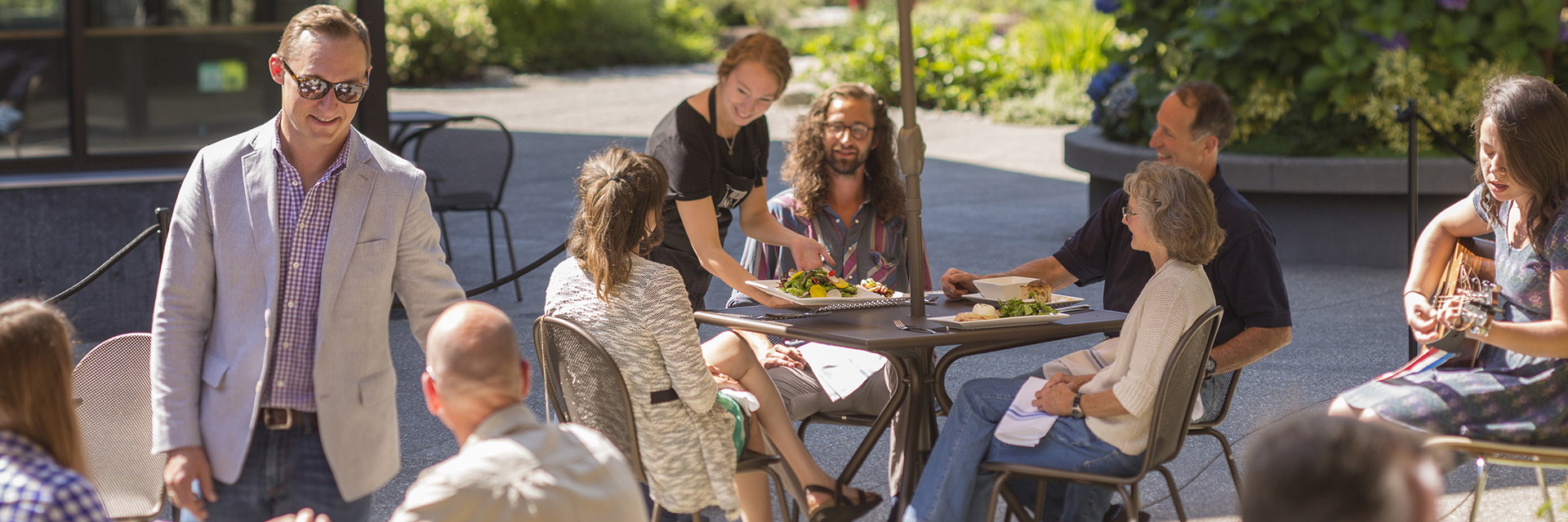 Customers enjoying a sunny afternoon at the BIMA Bistro