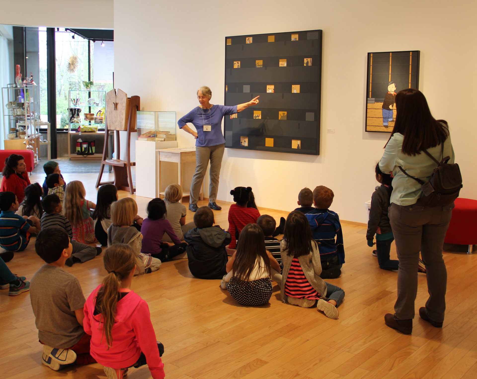 A student group enjoys a free docent-led field trip during BIMA's show commemorating the 75th anniversary of the forced removal of Japanese-Americans on Bainbridge Island.