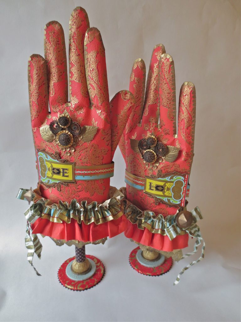Patty Grazini, Elizabeth Lyska’s Gloves, 2012, paper, 15”h x 8”w. Collection of the Artist.