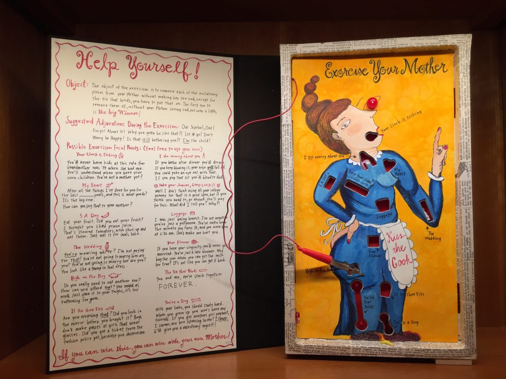 Mare Blocker, The Ultimate Self-Help Book, 2014, one-of-a-kind altered game, mixed media, and cloth covered book board box, 16” h x 9.5”w x 2.5d (closed), 21”l x 9.5”w x 2.5d (open). Private Collection.