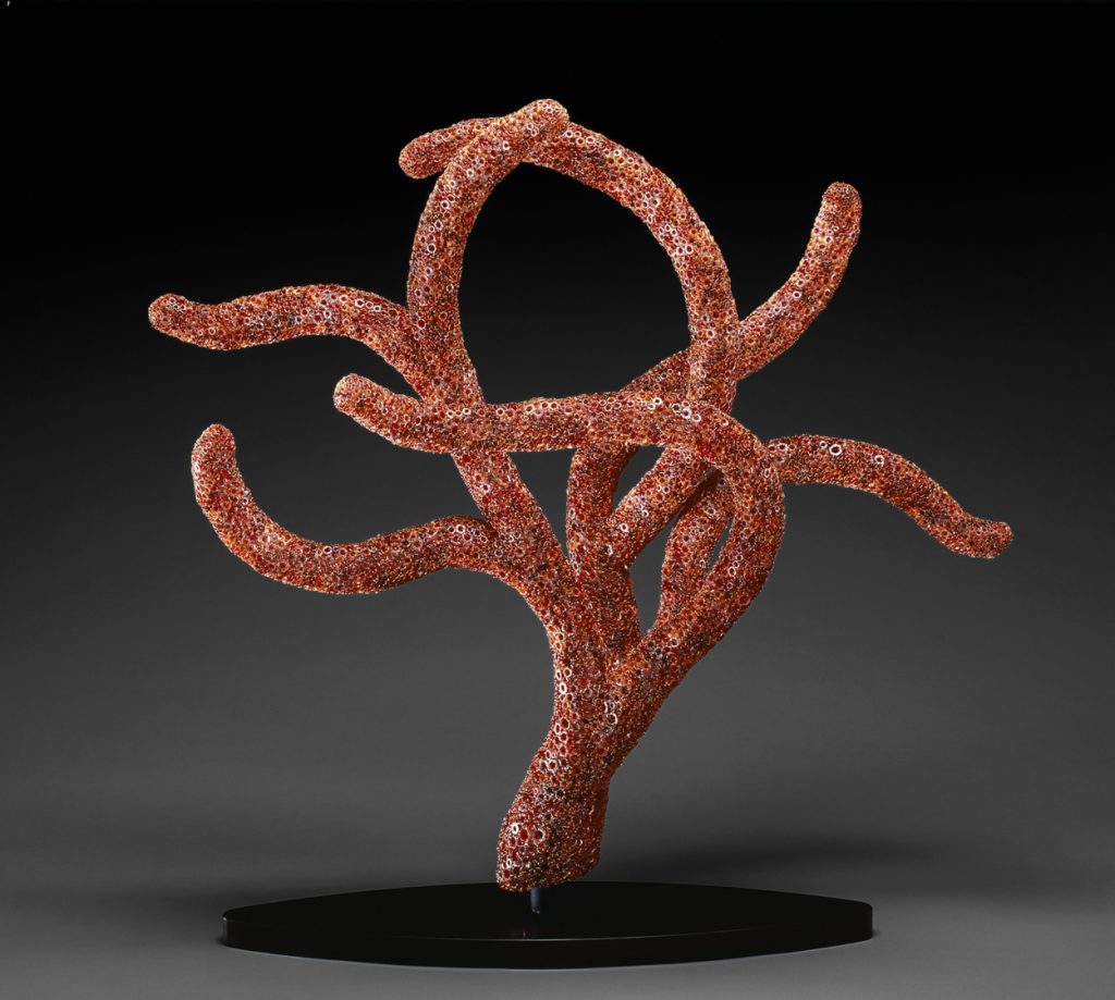 Kait Rhoads, Red Polyp, 2007, blown glass, mixed red hollow murrine woven with copper wire onto a powder coated steel frame set on a solid steel base, 45" high x 46" wide x 19" deep.