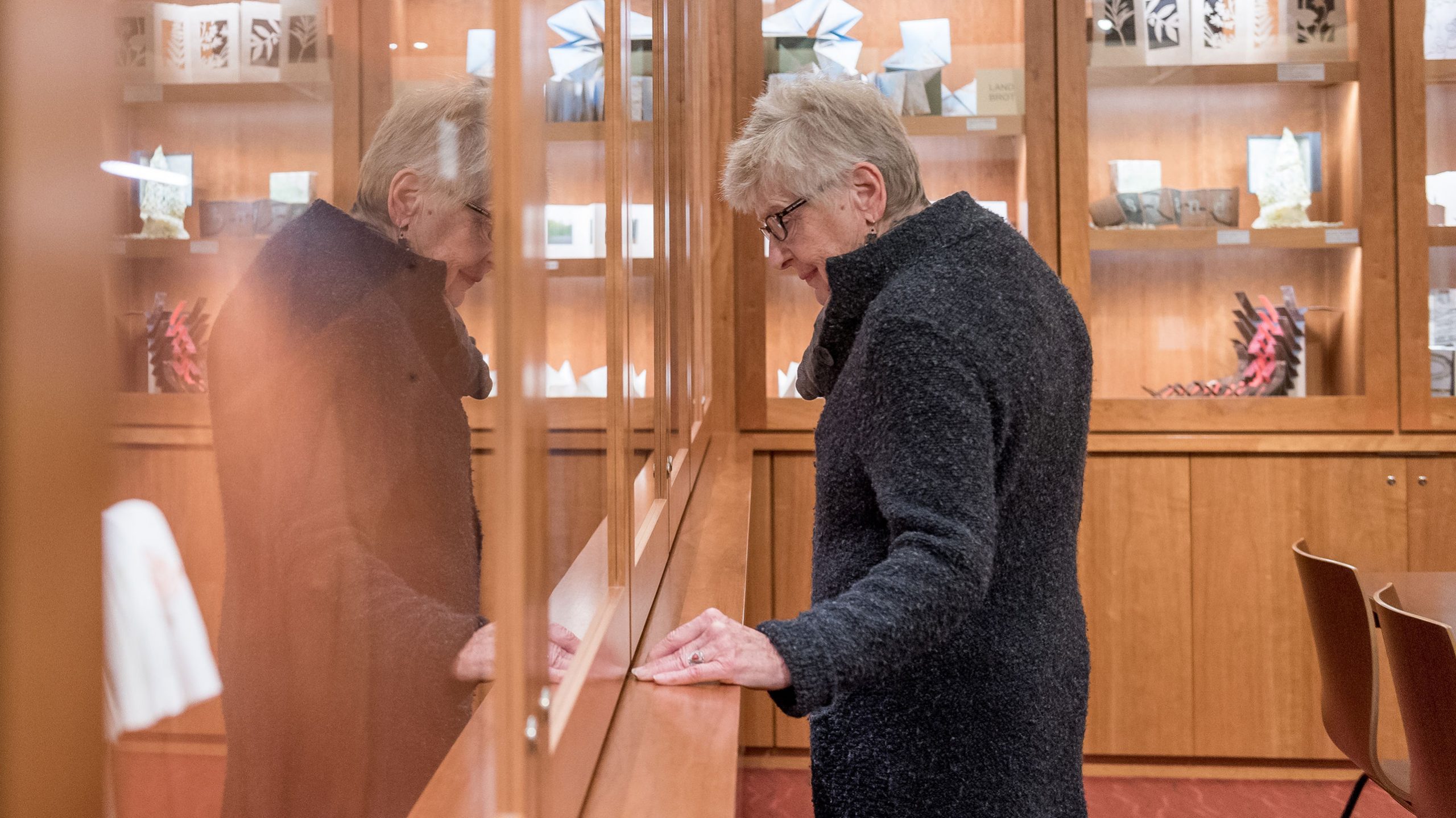 Woman looking at art in Sherry Grover Gallery