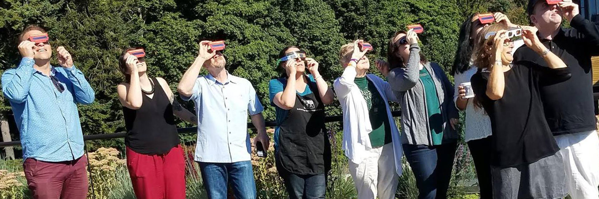 Staff watching the solar eclipse.