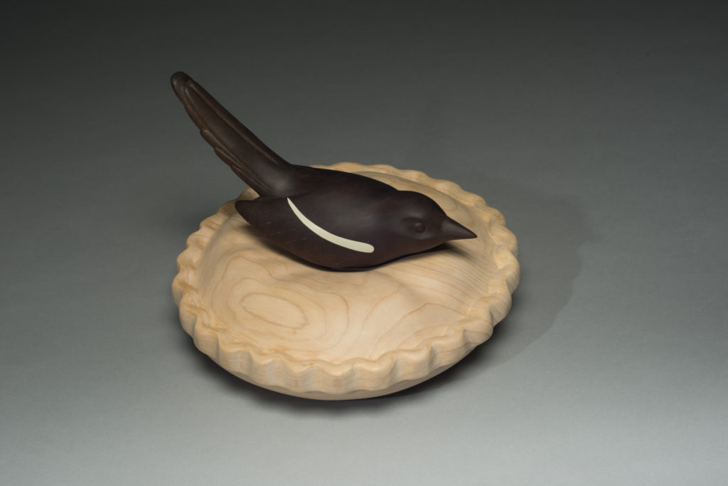 Marceil DeLacy, Magpie, Soft Landing, Port Orford cedar and black walnut, 11" diameter, 8"h. Courtesy of the Artist.