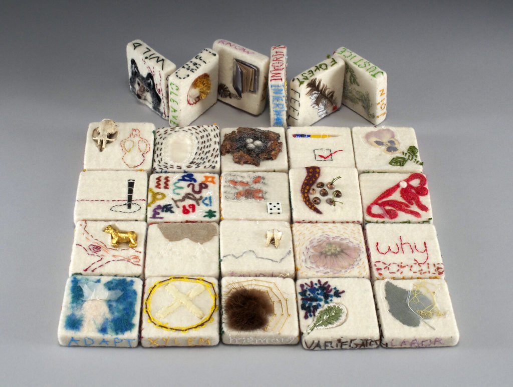 Alisa Banks (Dallas, TX) and Diane Jacobs (Portland, OR), Interwoven Alphabet, 2019, twenty-six wool felt blocks, thread, paper, plants, fur, bone, found objects, mixed media, cloth-covered box, 2.5"h x 2.5"w (each block); 10.5"h x 5.75"w x 3"d (open), edition of two, Cynthia Sears Artist's Books Collection