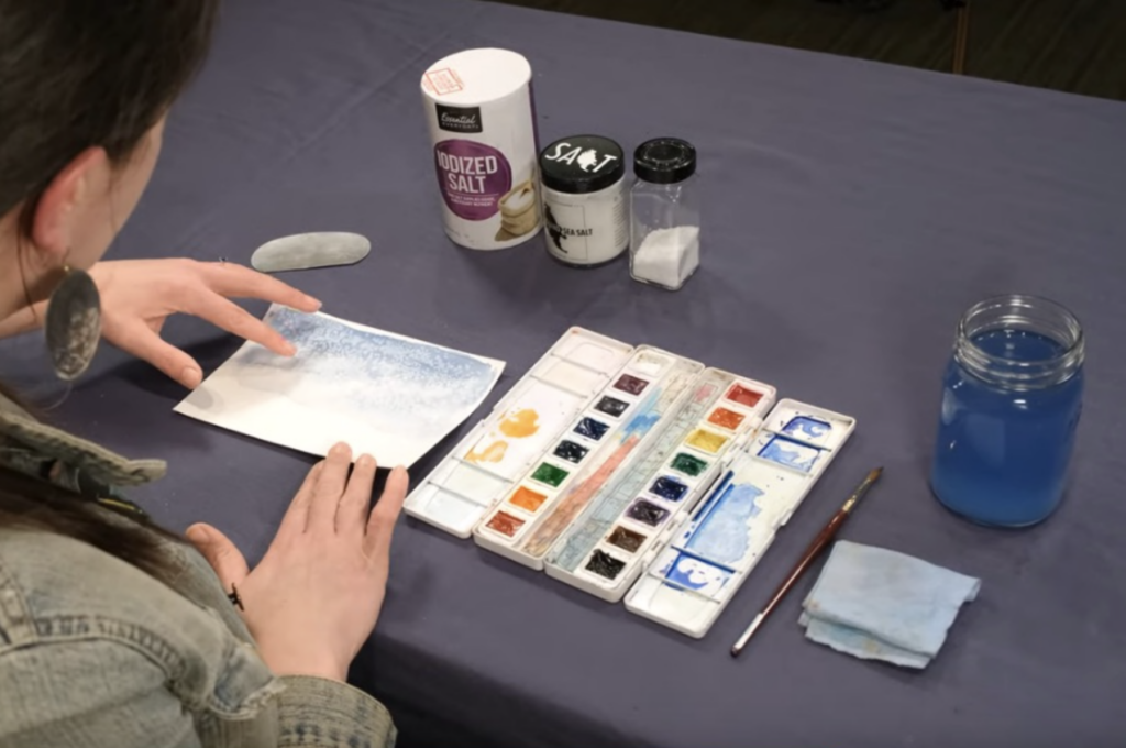 Teacher demonstrating watercolor technique