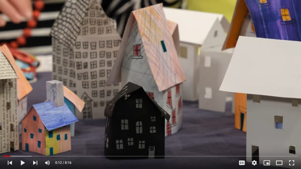 Paper houses make a village on a tabletop