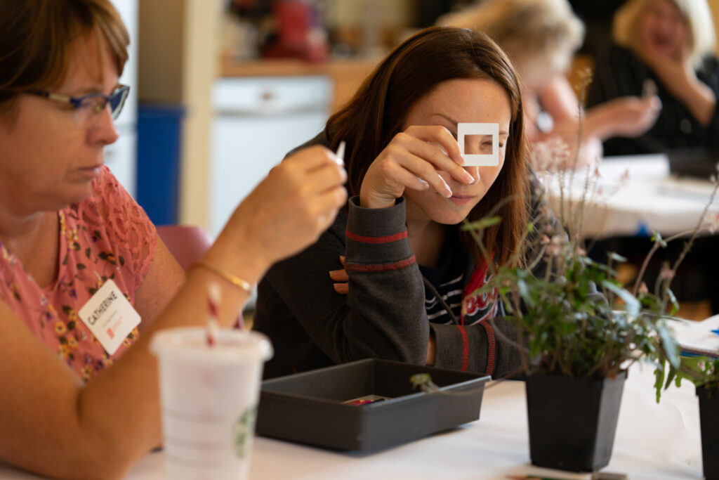 Educators participating in a hands-on project during a professional development workshop