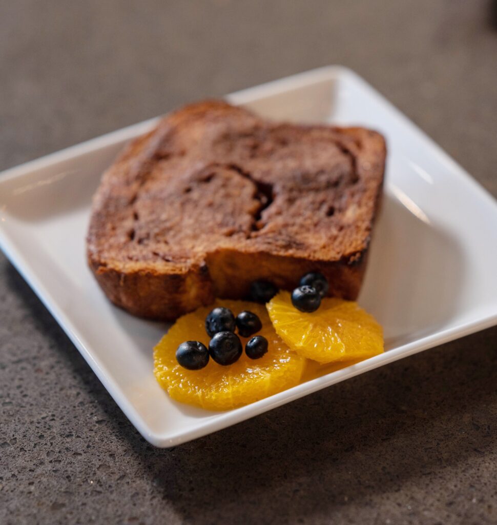 Cinnamon toast with orange slices and blueberry