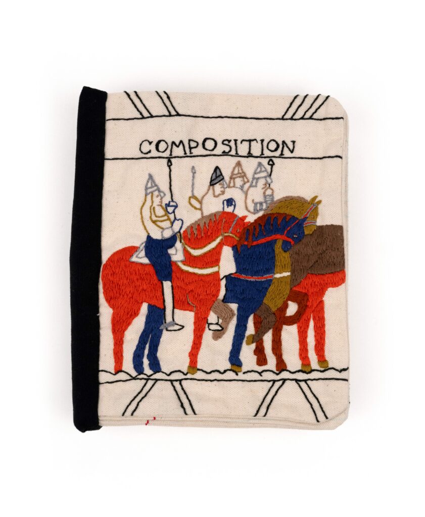 A canvas made book with embroidery of horses with people riding them the title says composition 